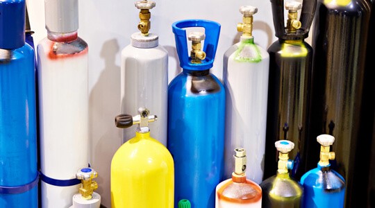 Metal cylinders for compressed gases