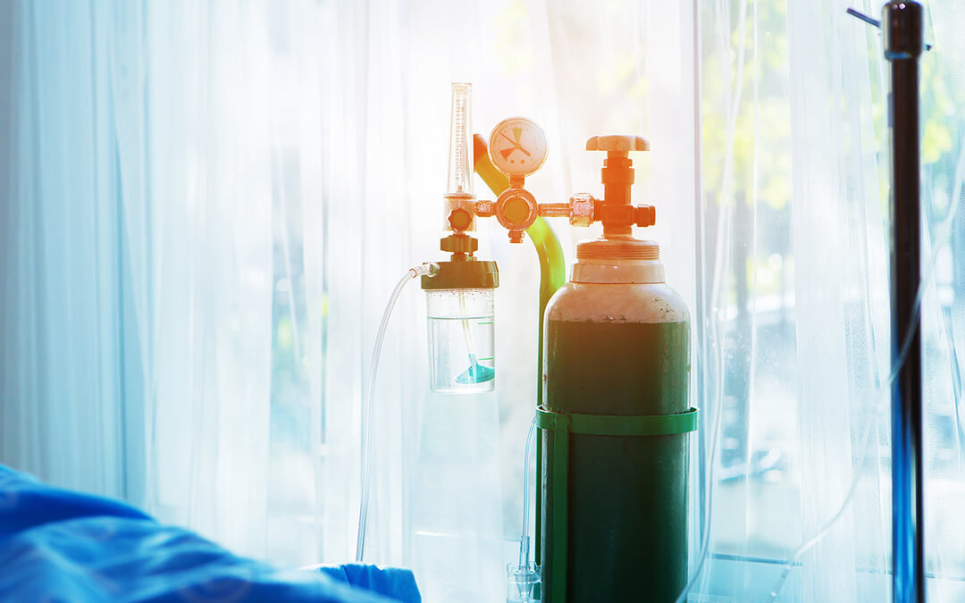An oxygen tank in a hospital room.