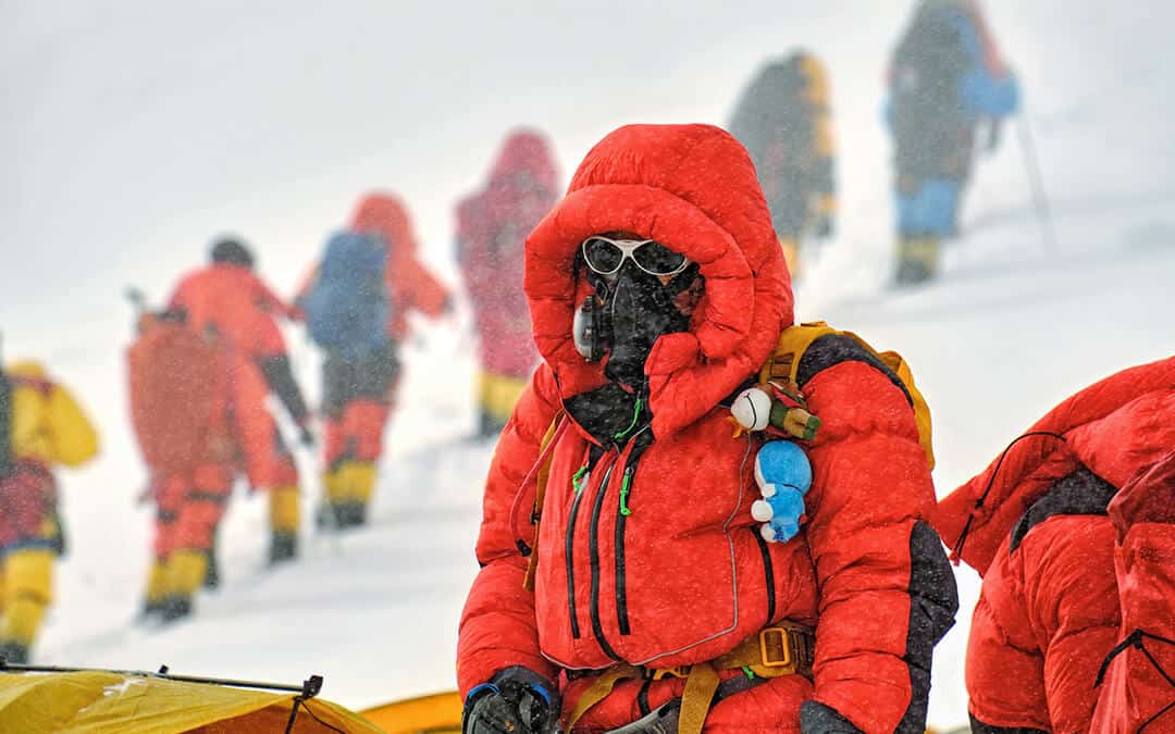 High altitude climber with oxygen mask in the Himalaya mountains