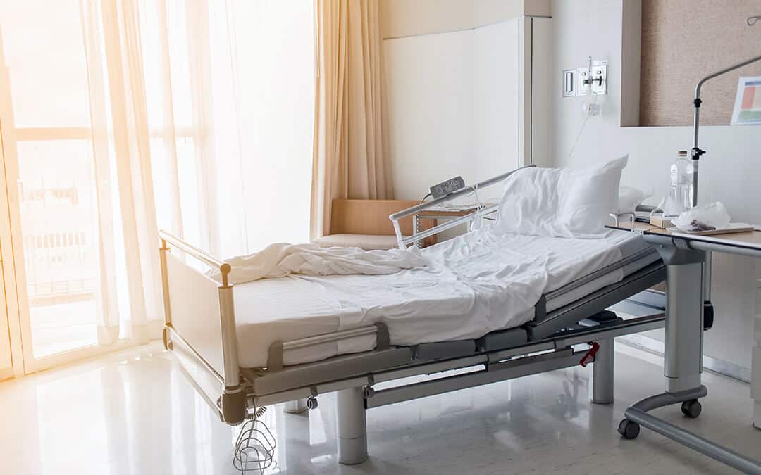 electrical adjustable patient bed in hospital room