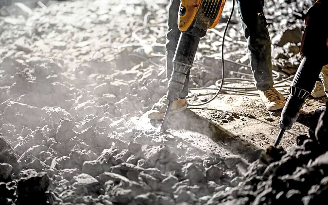 Road repairing works with jackhammer at night