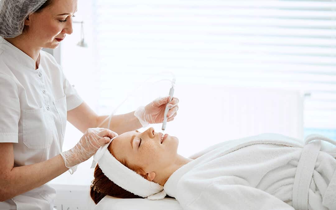 Woman doing an oxygen based spa treatment to another woman