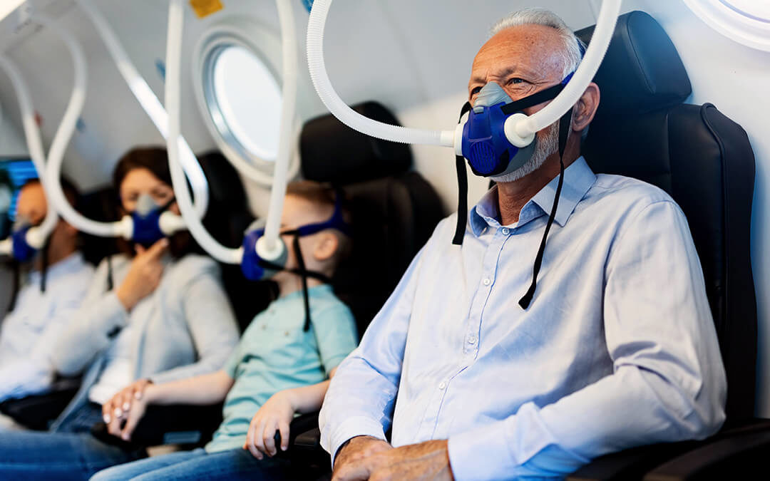 Four people with masks on for hyperbaric oxygen therapy
