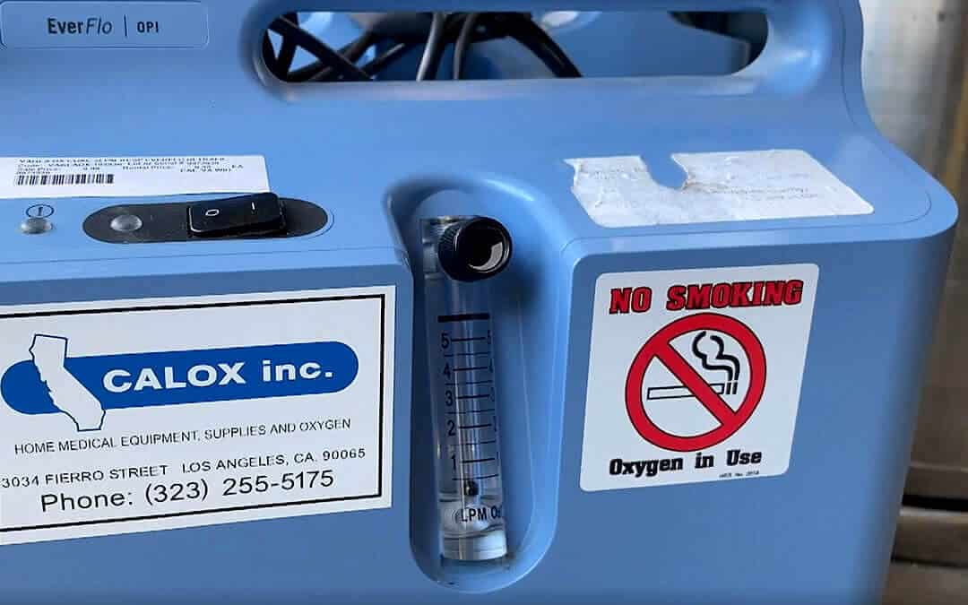Close up of a light blue medical oxygen machine