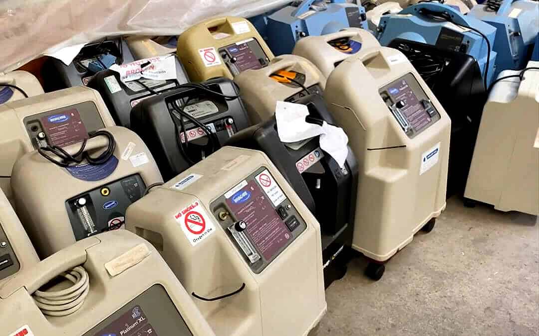 Many portable oxygen machines next to each other