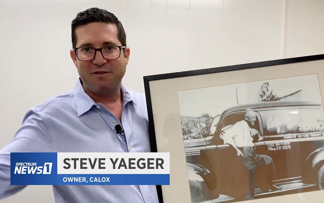 Steve Yaeger of CalOx holding an old black and white photo