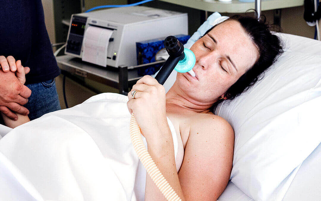 Woman using self-administered nitrous oxide