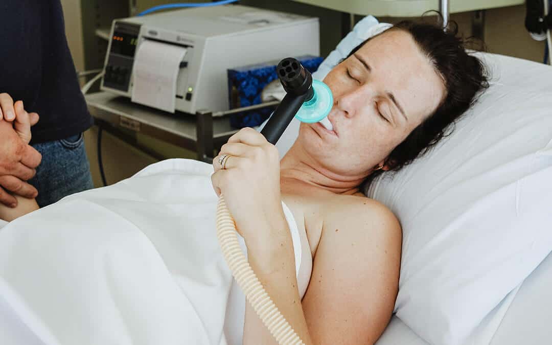 Medical Gas therapy - Woman using self-administered nitrous oxide