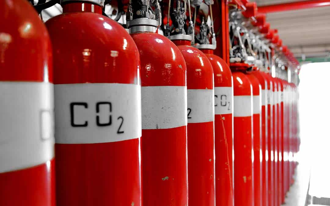 CO2 Rationing: A row of red tanks of CO2