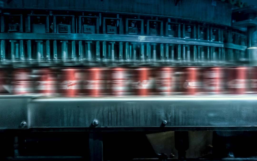 Carbonated beverages: cans on a conveyor belt