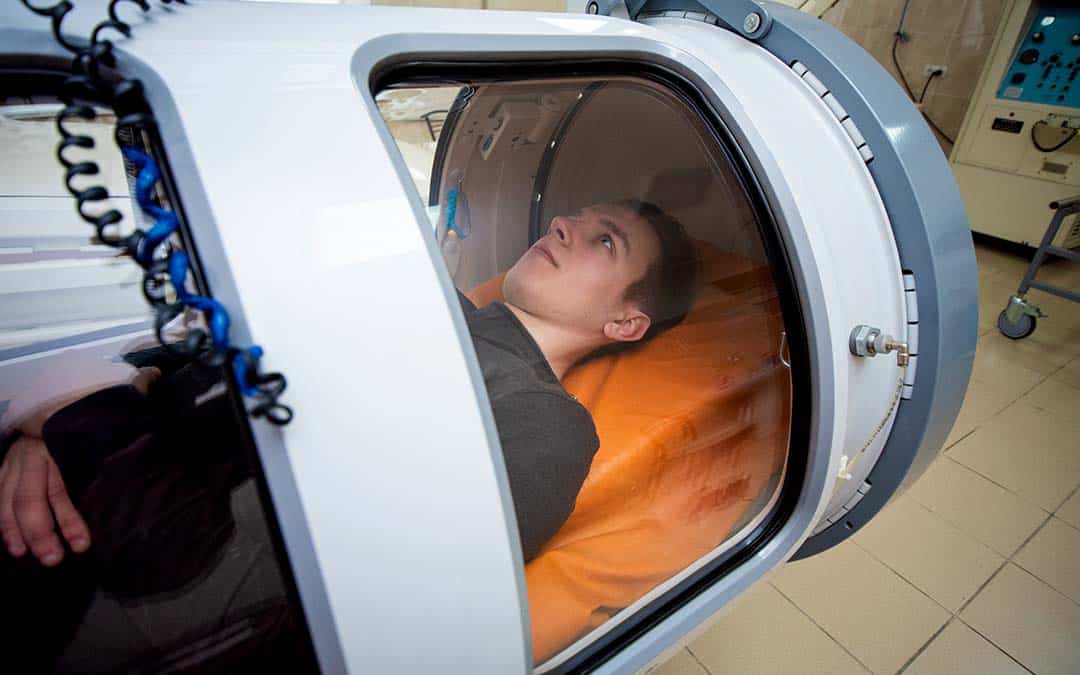 Patient in hyperbaric chamber