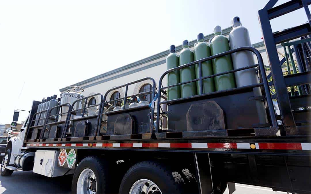 A truck loaded with oxygen tanks.