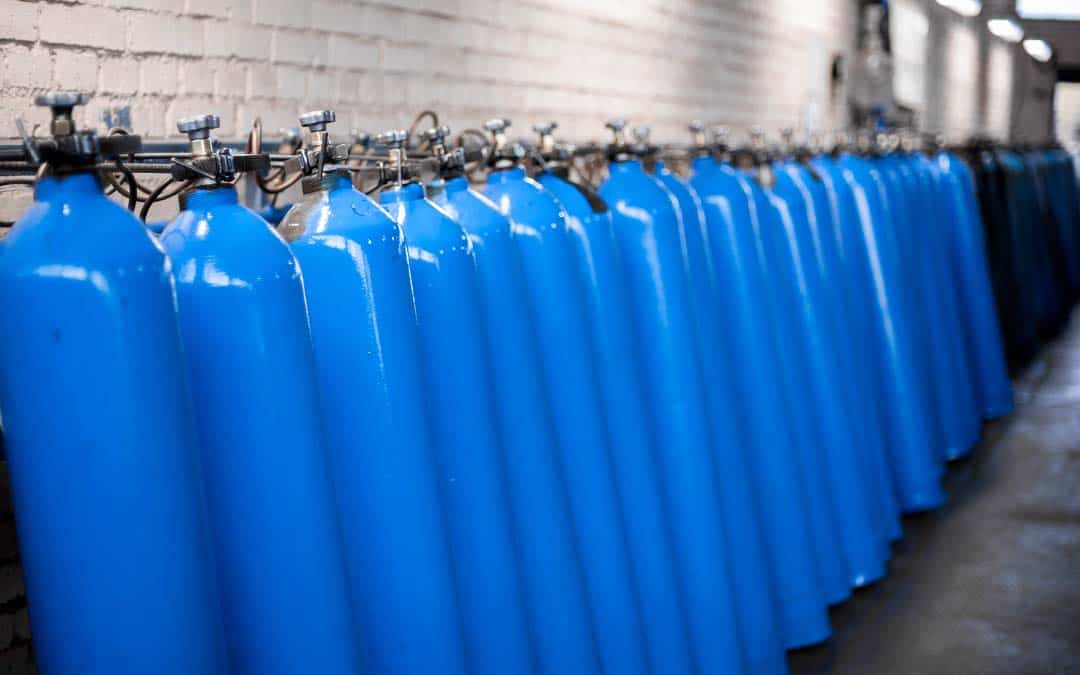 Medical Gas Industry Surge - a line of blue tanks