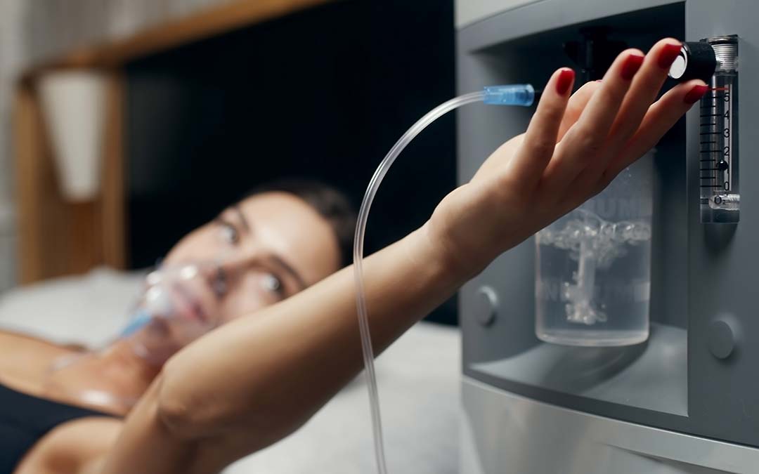 woman wearing an oxygen mask from an Oxygen Concentrator